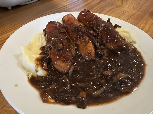 Sausage and mash, home cooked, with a caramelised onion gravy
