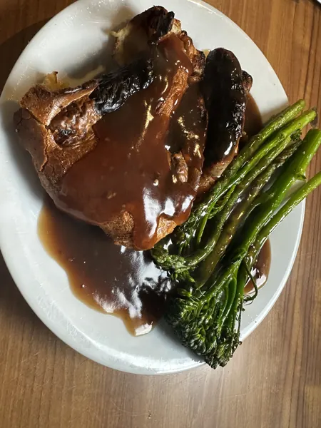 Home made toad-in-the-hole with broccoli